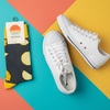 Socks with lemon design on a wooden surface
